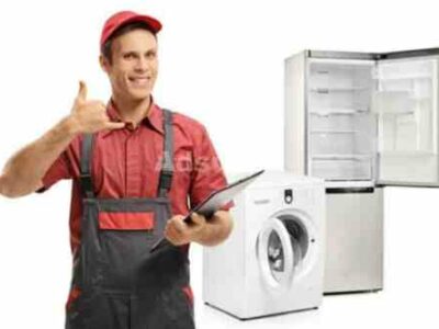 91716531-repairman-with-a-clipboard-making-a-call-me-gesture-in-front-of-a-washing-machine-and-a-fridge-isola-1