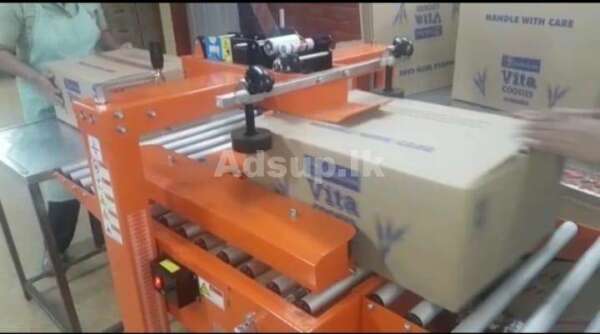 Carton Sealing Tapping Machine – Chinese